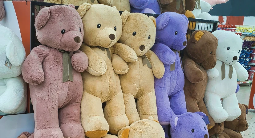 Multicolor teddy bears plush toys on retail shelf