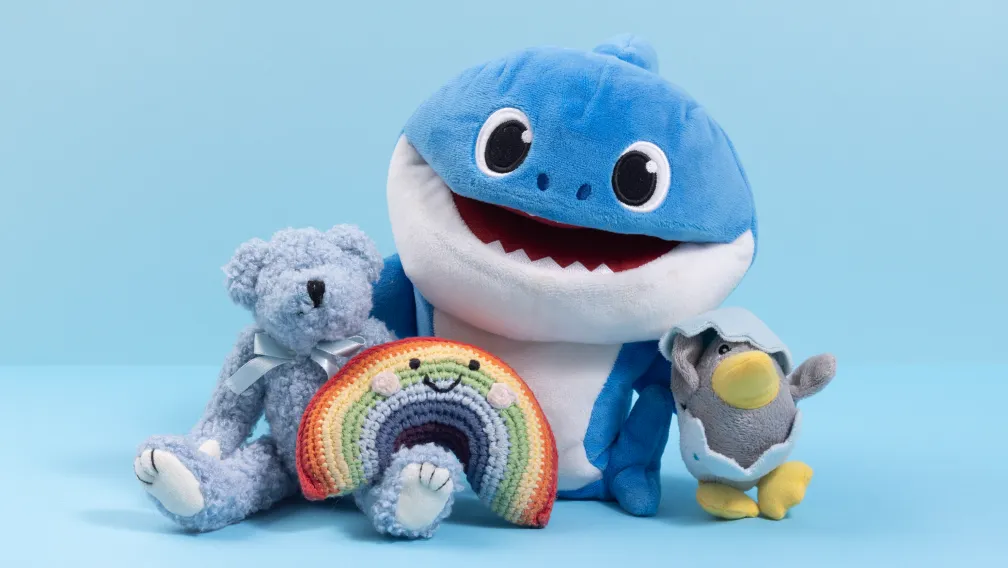 A detailed technical breakdown showing the internal components, fabric layers, and glass microbead pouches of a custom weighted plush toy